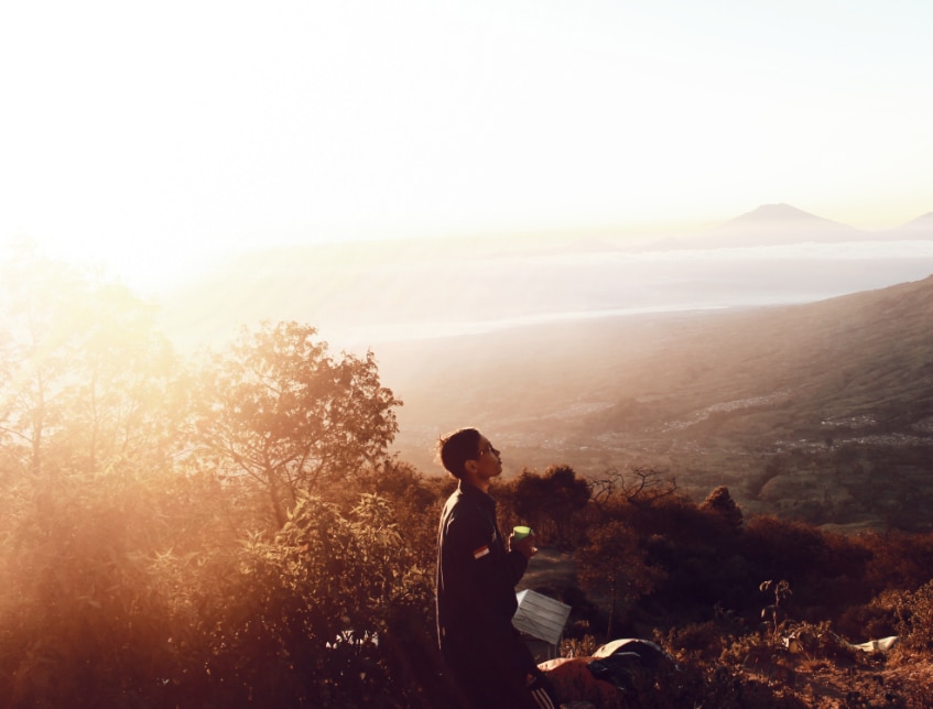 person meditating in nature showing resilience in the face of alcohol addiction treatment