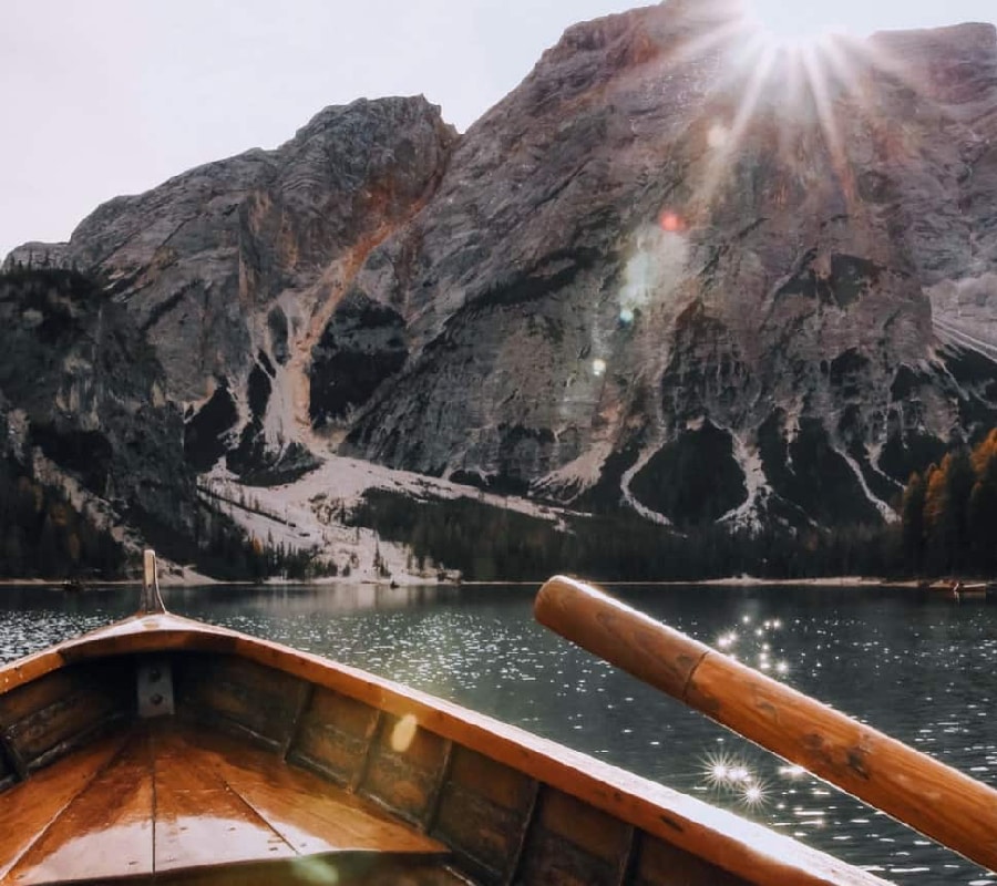 Bow of a boat facing a sunrise, symbolizing the start of a new journey towards recovery from prescription drug addiction.