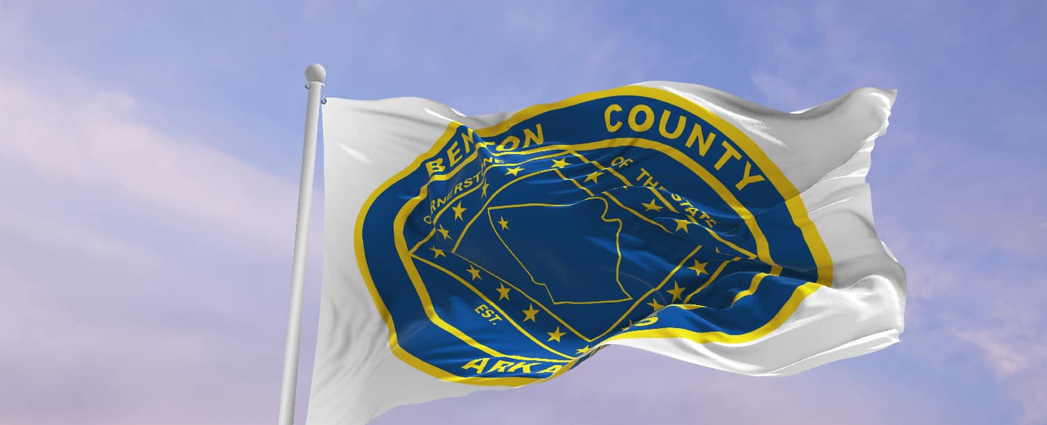 The Benton County flag fluttering with resolve, reflecting the commitment of "Outpatient Addiction Treatment in Benton County" to serve the community.