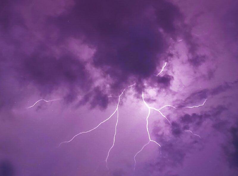 Dramatic lightning illuminating the night sky, symbolizing the sudden and impactful effects of MDMA drug use.