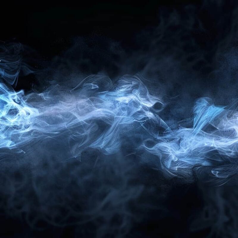 Blue vapor against a clean black backdrop to show what freebase smoke looks like.