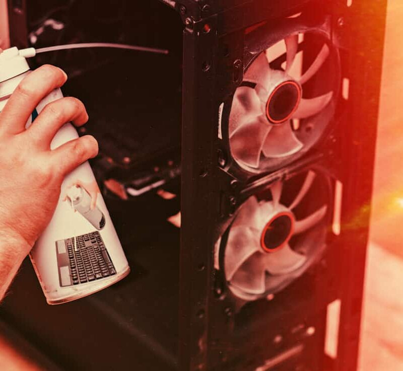 Close up of a person using compressed air, the kind that is often used to get a duster high.